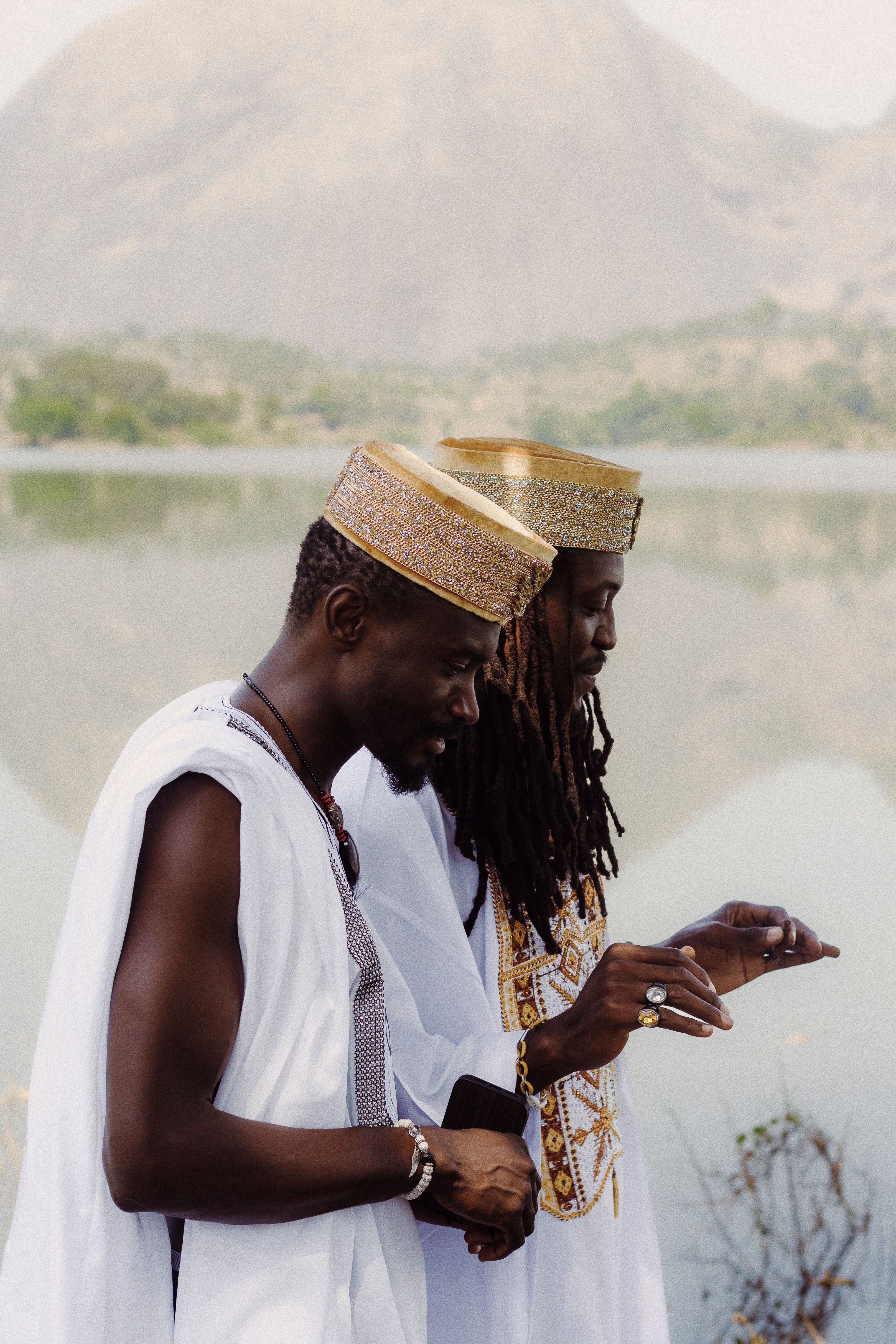 Traditional Nigerian Attire by a Lake · Free Stock Photo
