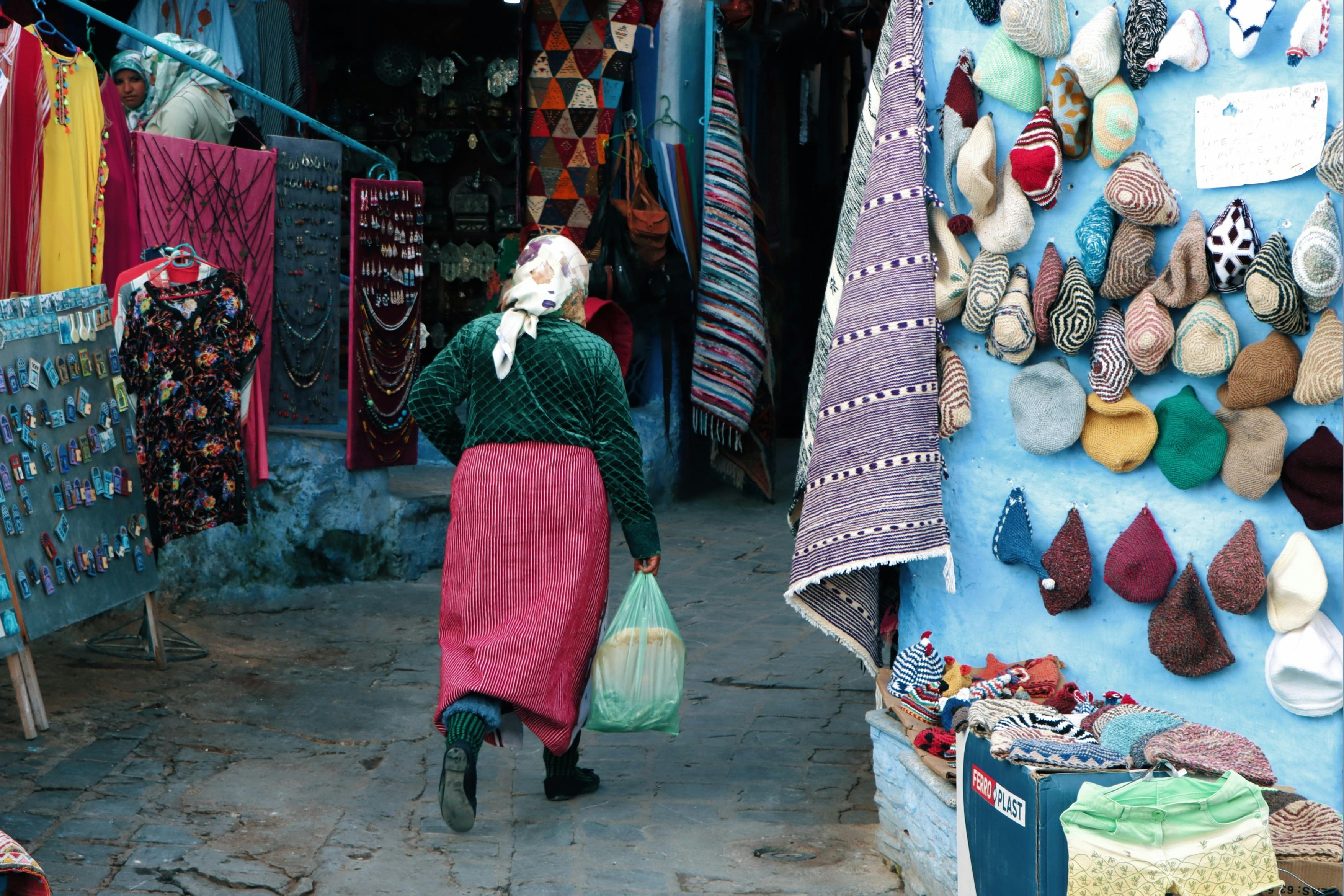 A vibrant Moroccan street market with colorful textiles and handmade crafts.