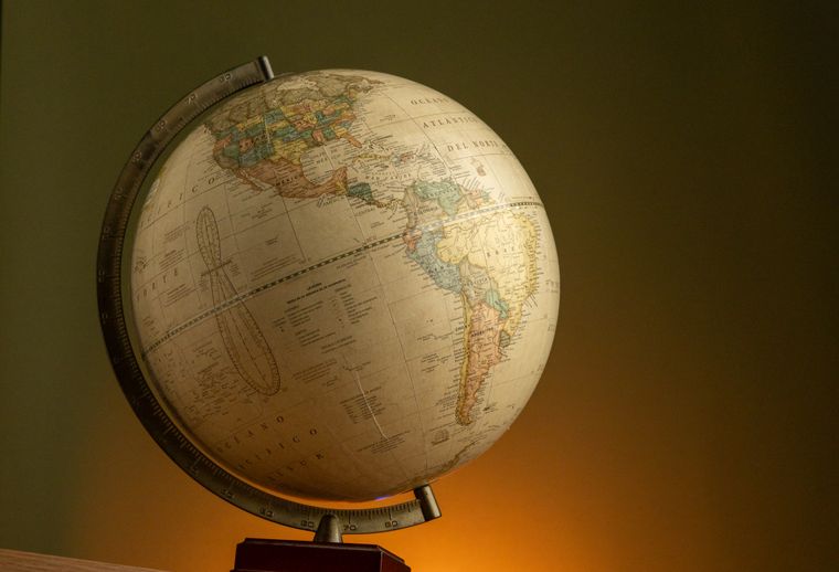 Vintage globe lit with warm ambient light — photo by Amar Preciado on Pexels