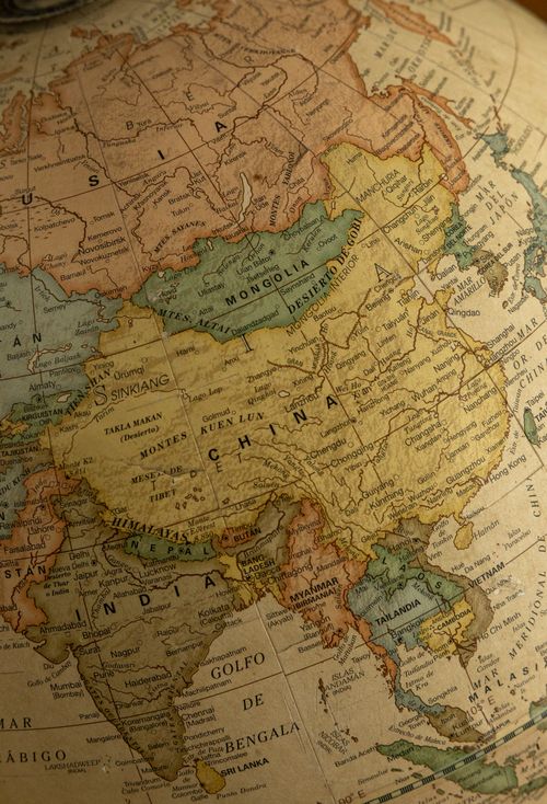 Free Antique globe map featuring East Asia with countries like China and Russia highlighted. Stock Photo