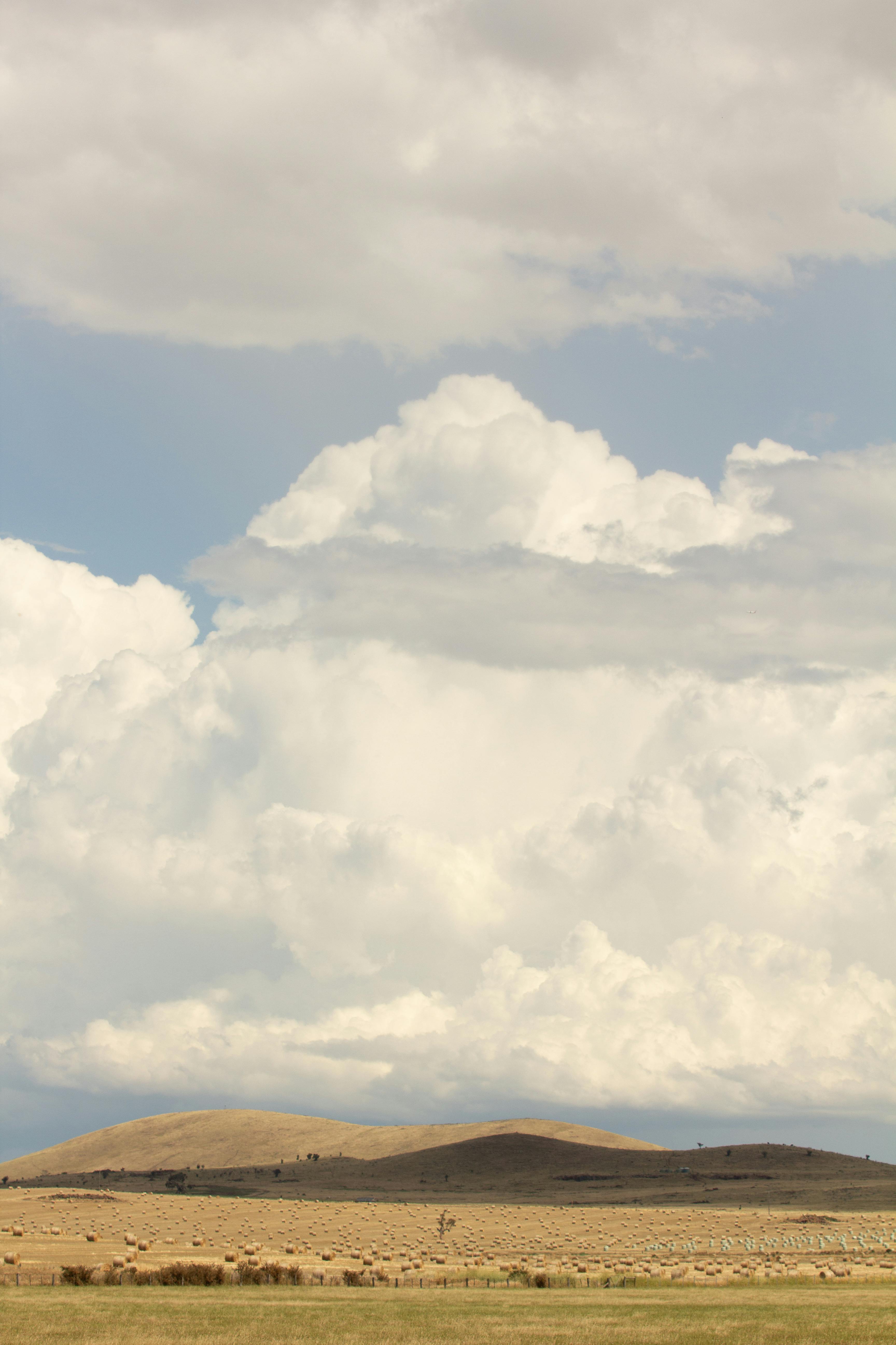 Scenic view of clouds over rolling hills in Beechworth, Victoria, Australia. Ideal for nature or landscape themes.