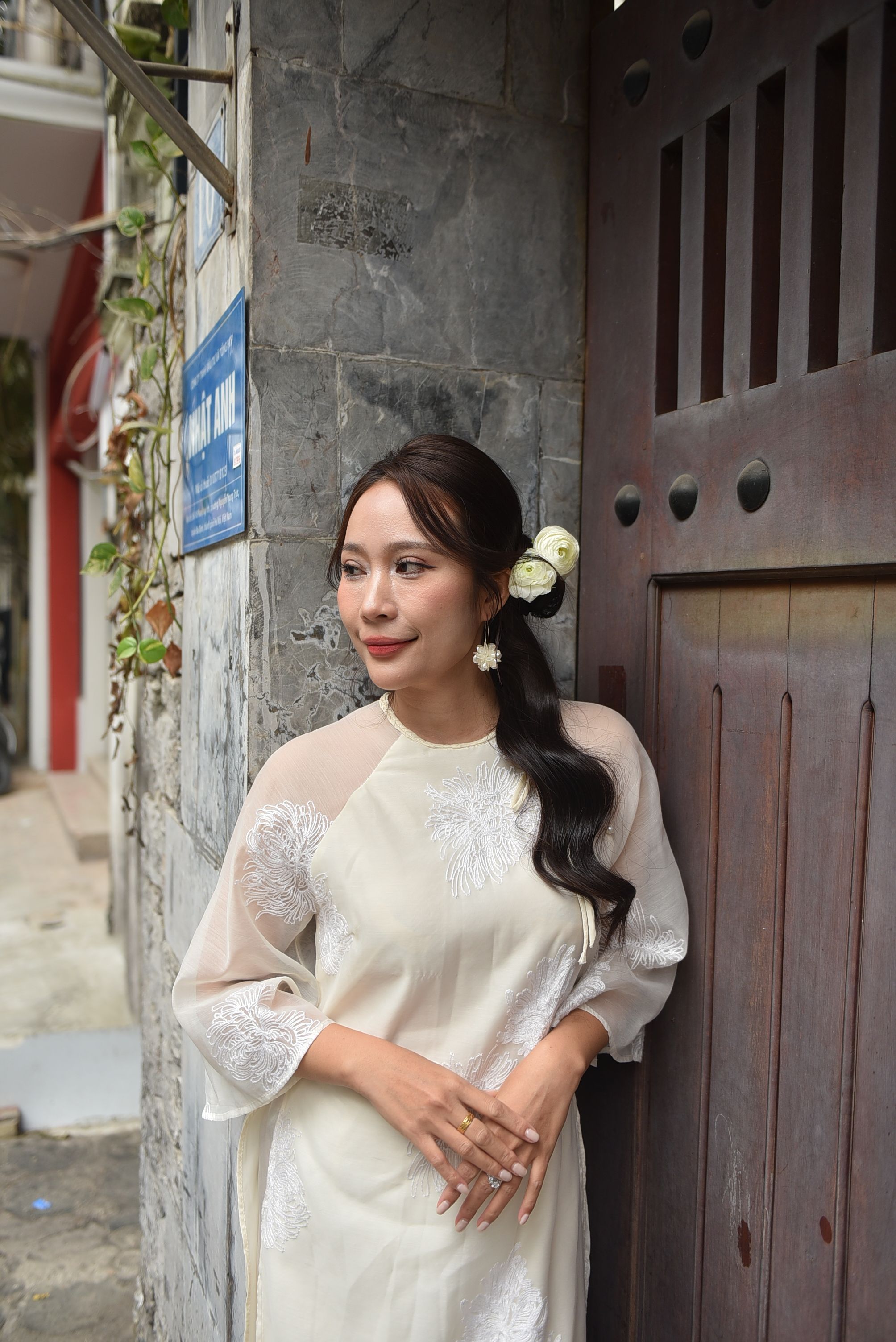 Woman in Traditional Dress by Stone Wall · Free Stock Photo