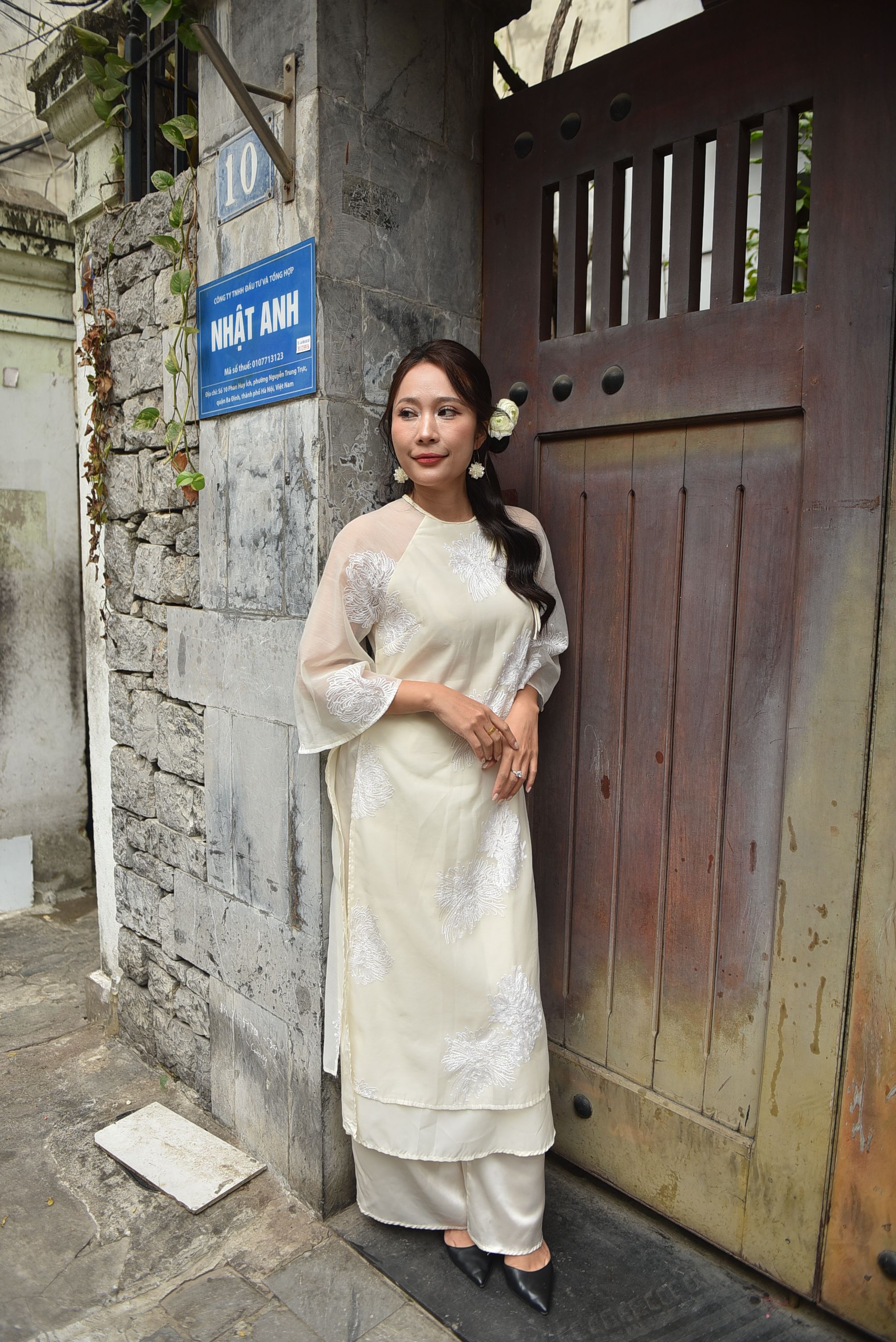 Woman in Traditional Dress by Rustic Gate · Free Stock Photo