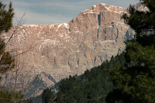 Stunning view of the Taurus Mountains with snowcaps and lush forest in Belemedik, Adana.
