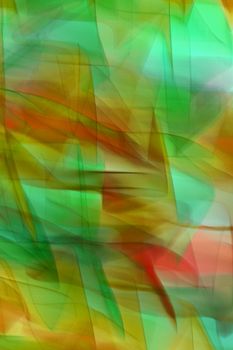Colorful abstract background featuring wavy patterns of green, yellow, orange, and red hues.