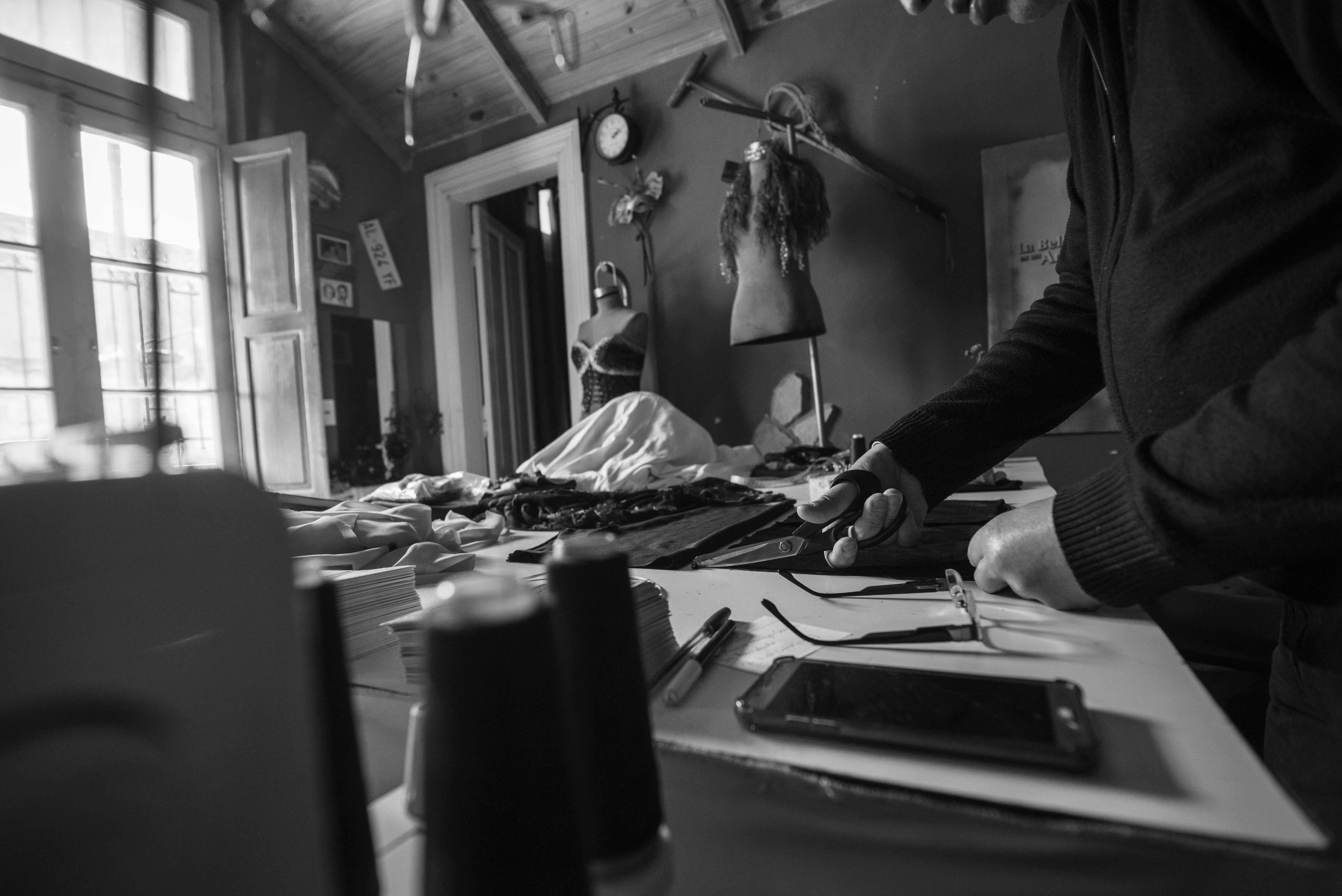 black and white seamstress workshop scene