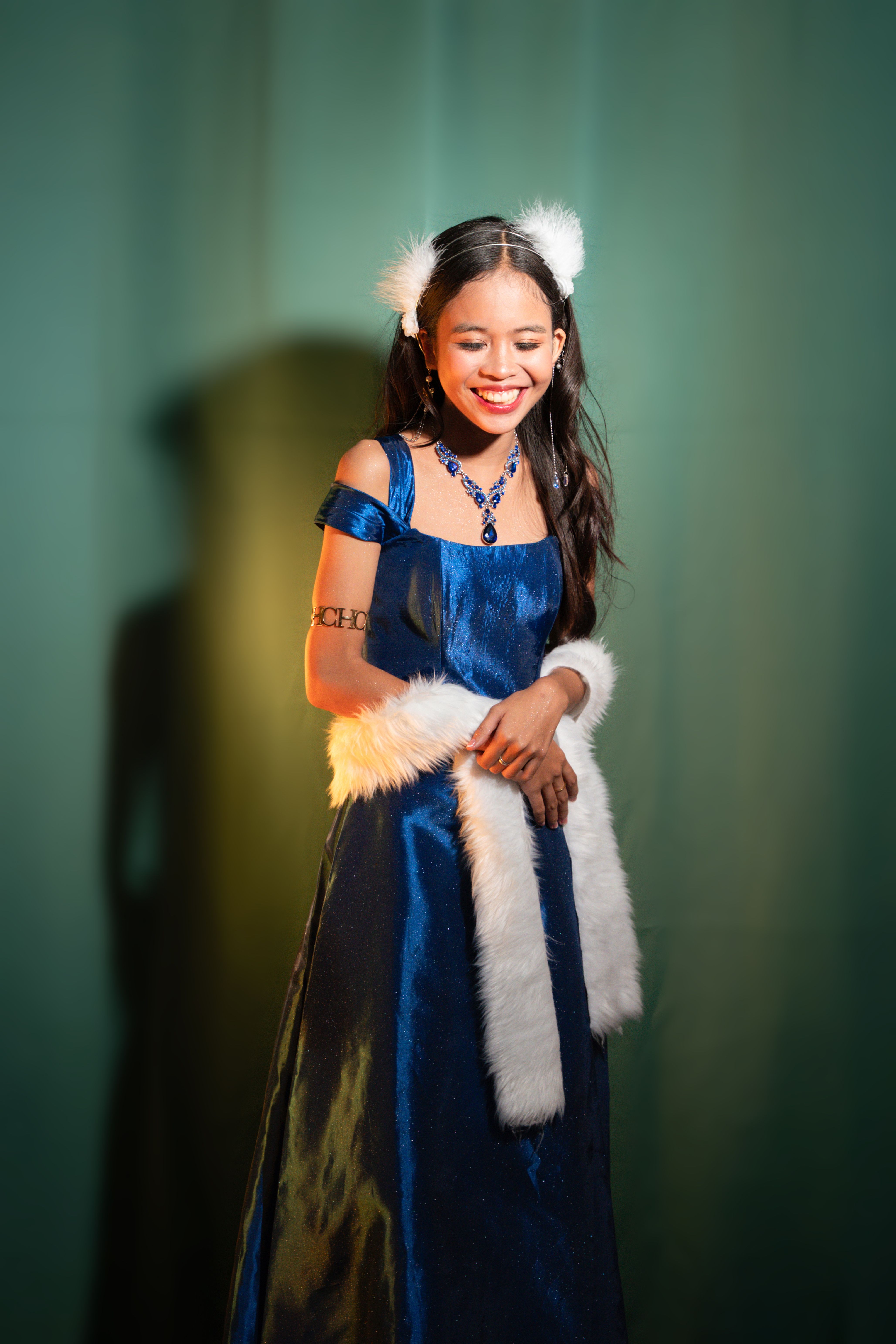 Young Woman in Elegant Blue Dress Smiling  Free Stock Photo