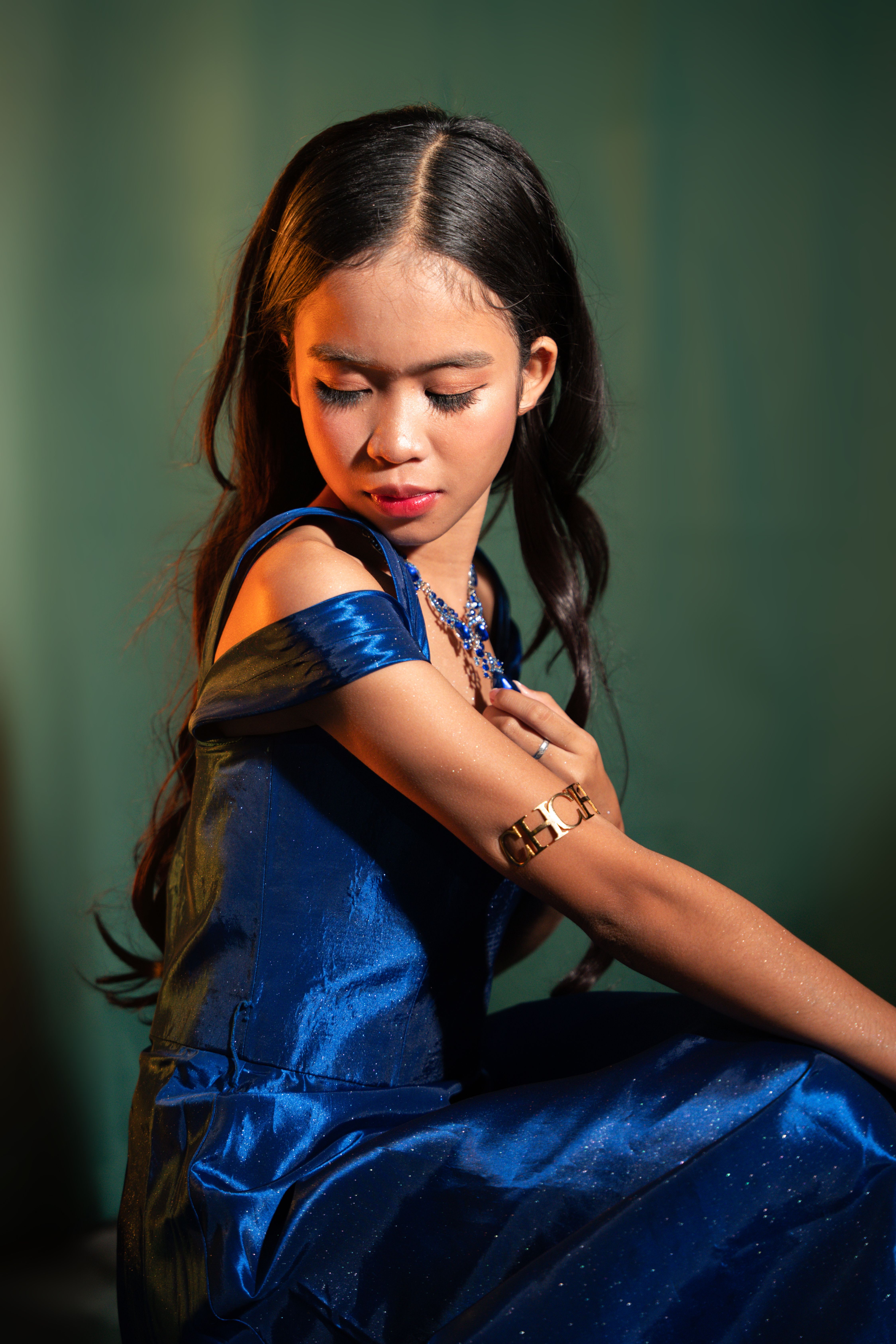 Elegant Portrait of a Young Woman in Blue Dress · Free Stock Photo