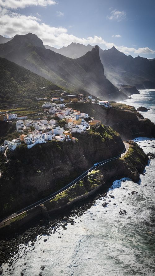 Free Breathtaking view of a coastal village and rugged landscape in Tenerife, Canary Islands. Stock Photo