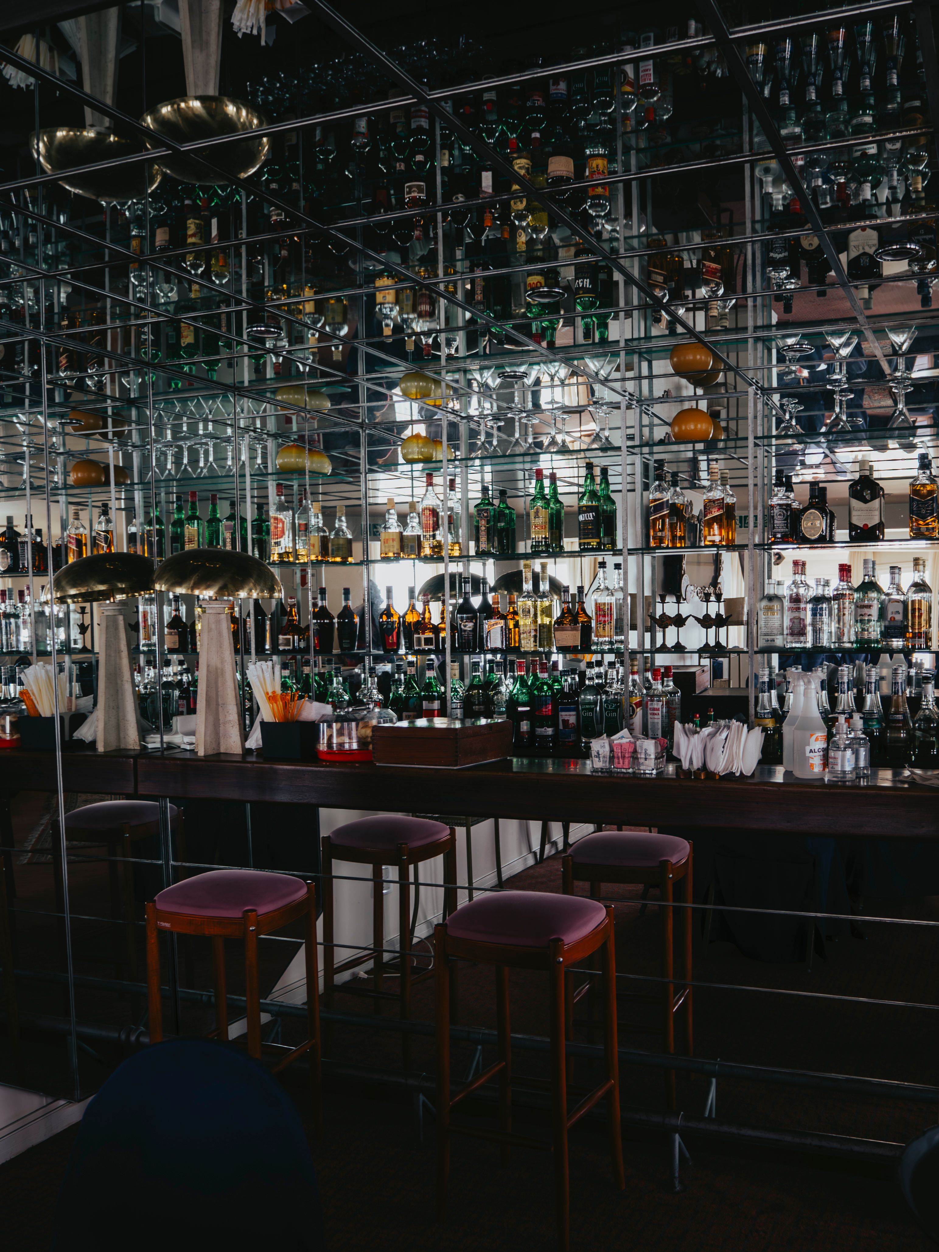 Contemporary Bar with Mirror Reflections · Free Stock Photo