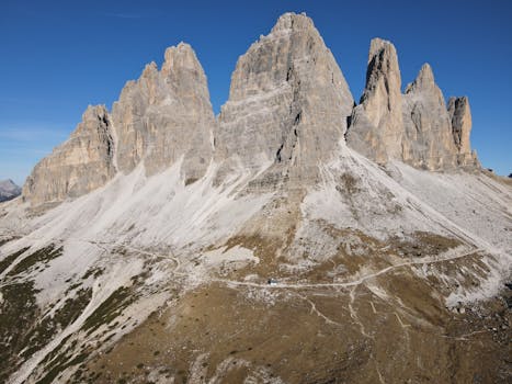 Breathtaking aerial shot of Tre Cime di Lavaredo, a UNESCO site in the Dolomites.