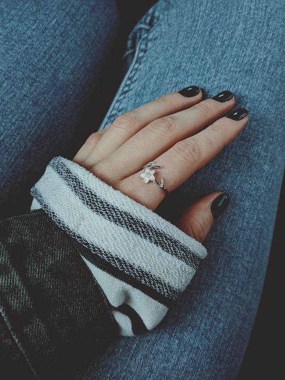 Silver Flower Ring On A Woman's Hand