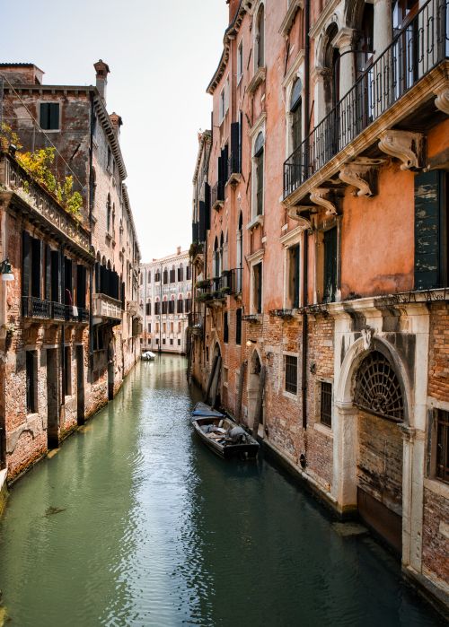 Free Scenic view of historic Venetian canal with traditional architecture and tranquil water. Stock Photo