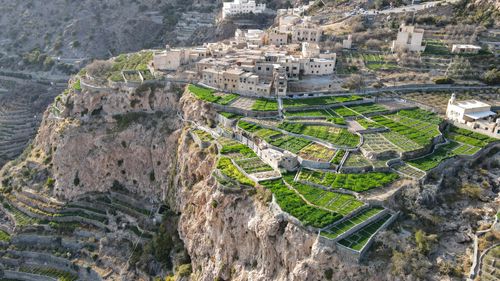 Free Breathtaking drone view of ancient terraced fields and hillside village, showcasing natural beauty and architecture. Stock Photo