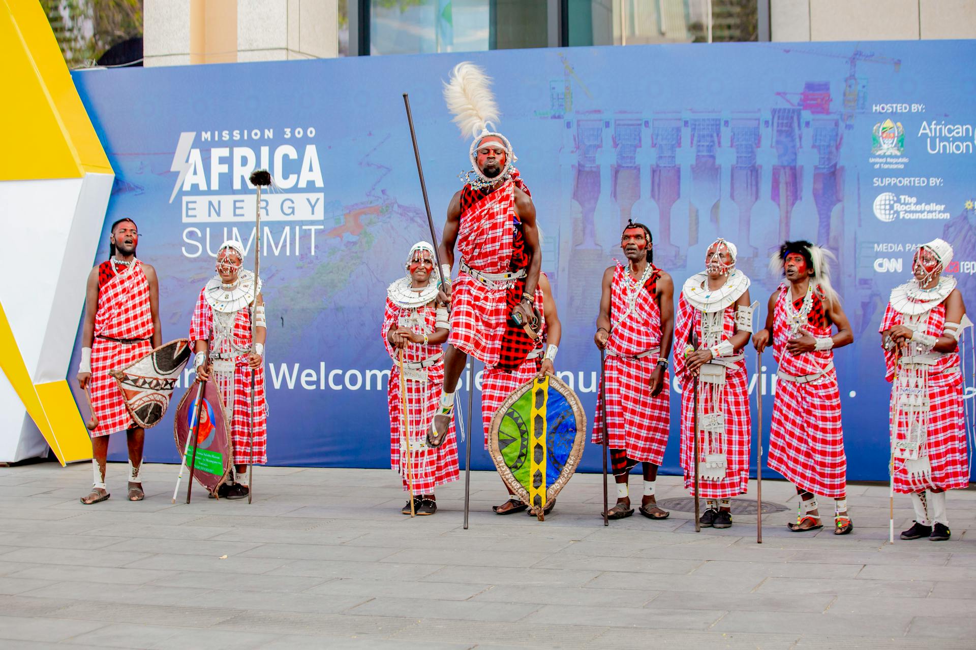 Maasai performers in traditional attire at Africa Energy Summit, offering a cultural welcome to delegates.