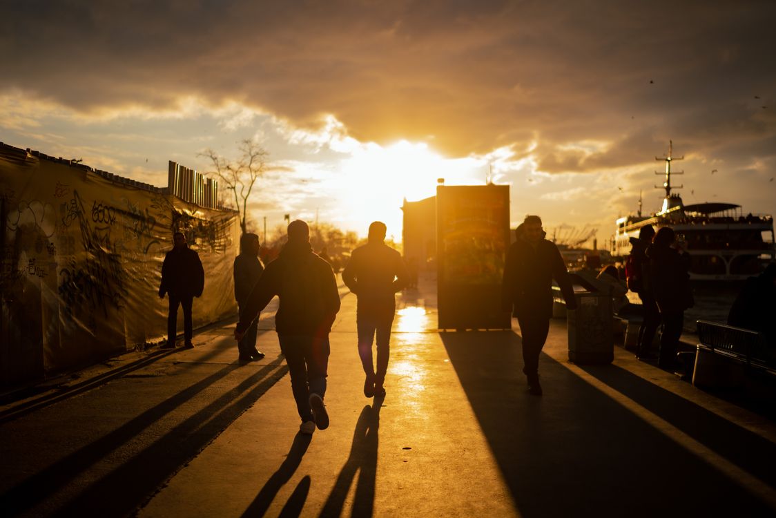 Silhouettes of People at Sunset on a Street · Free Stock Photo