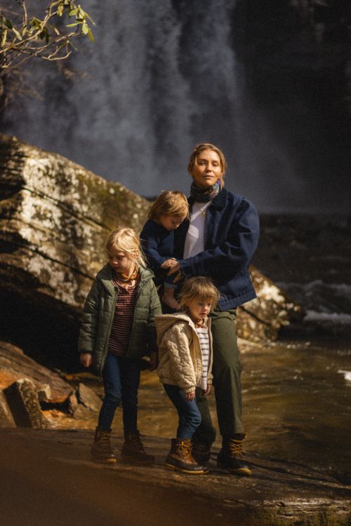 Free A family enjoying a day outdoors near a waterfall in Brevard, NC. Stock Photo