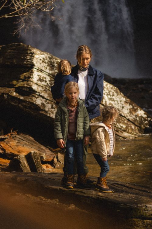 Free A family explores the outdoors by a waterfall in North Carolina. Stock Photo