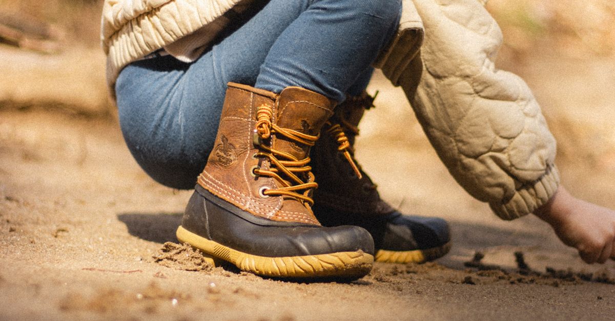 Kids Rugged Child Exploring Outdoors in Rugged Boots · Free Stock Photo