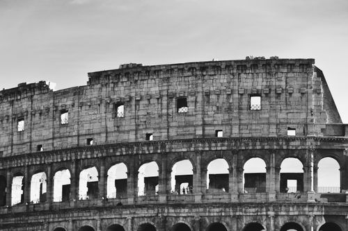 Free Captivating black and white photo of the historic Colosseum in Rome, showcasing its majestic architecture. Stock Photo