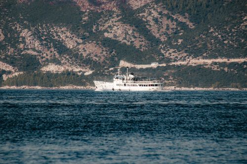 Free A picturesque ferry cruise along the Adriatic Sea near Croatia's lush coastline Stock Photo
