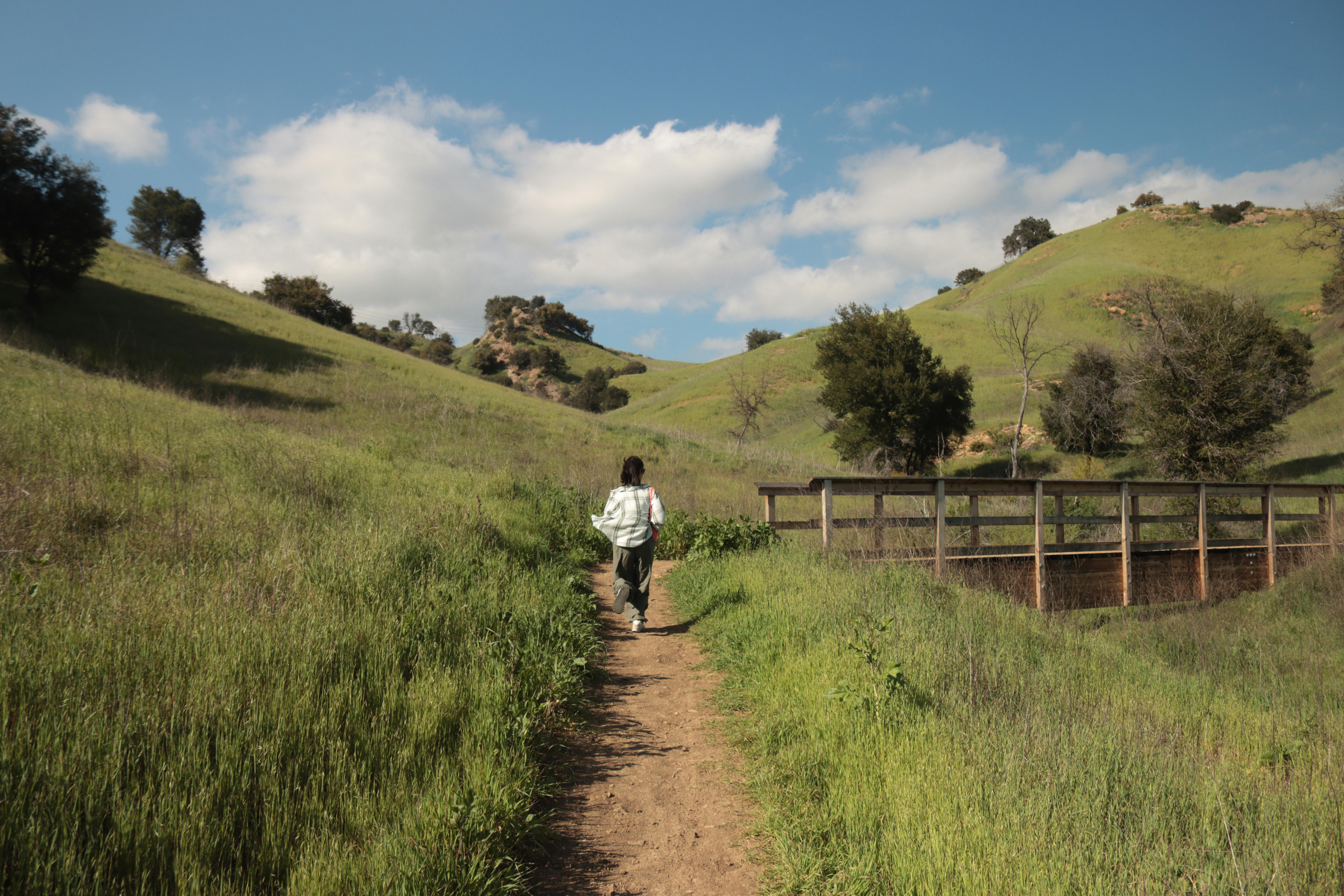 Woman hiking on a scenic trail in California