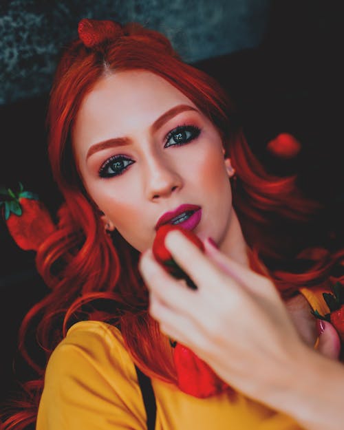 Close-up Photo of Woman Holding Strawberry