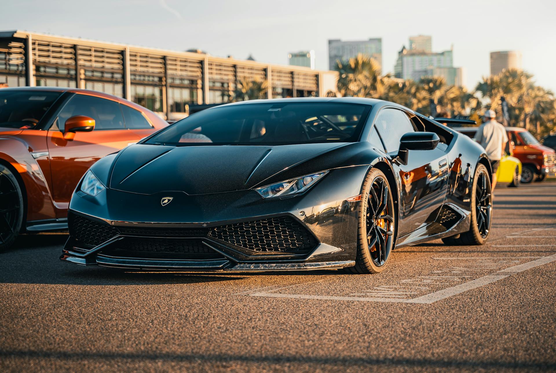 Sleek black Lamborghini sports car parked during golden hour in Tampa.