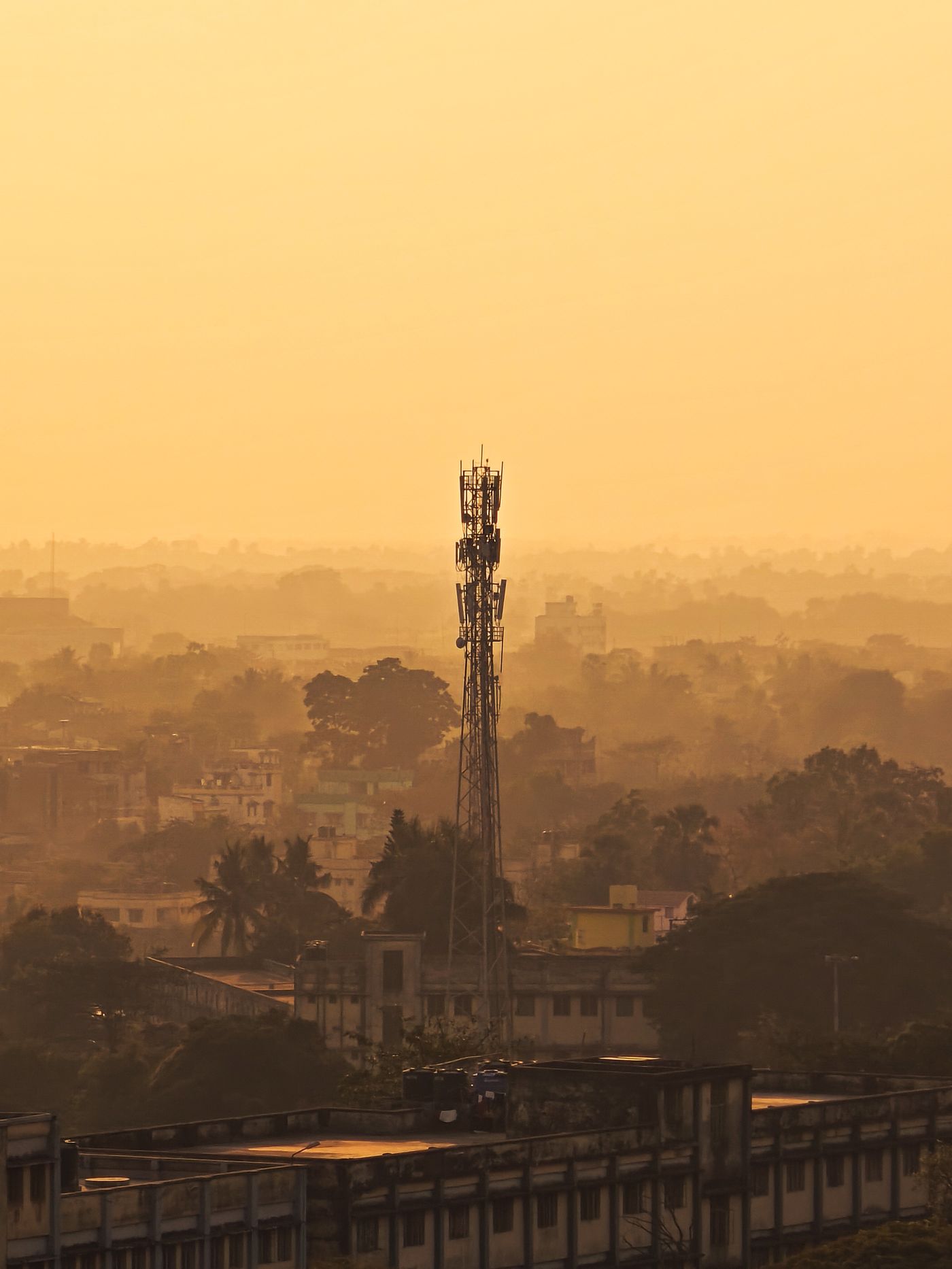 Urban rooftop with telecom tower