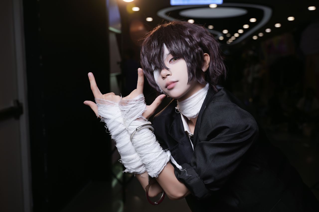 engaging portrait of a cosplayer posing dramatically in costume indoor
