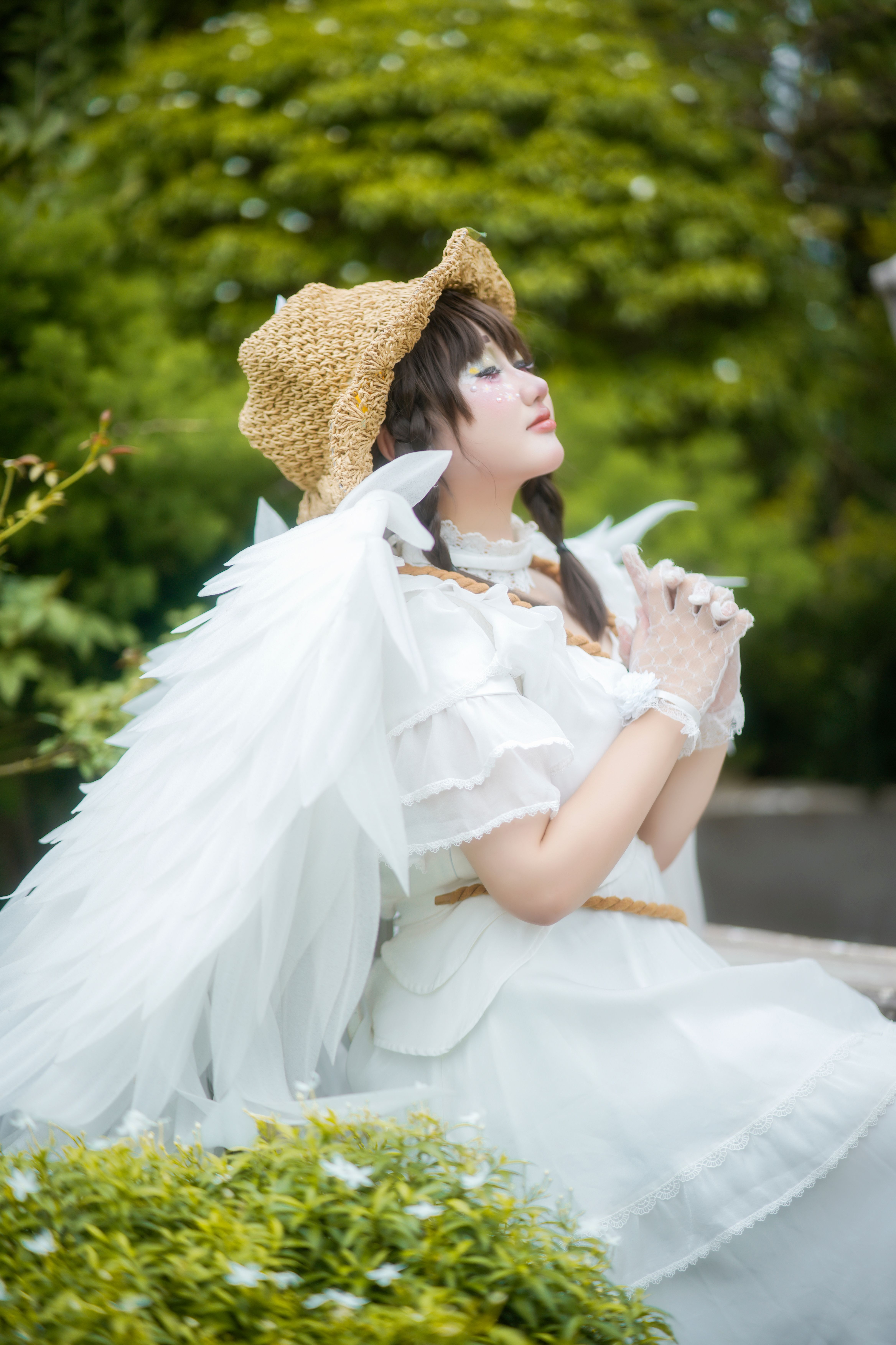 Ethereal Angel Cosplay in Garden Setting · Free Stock Photo