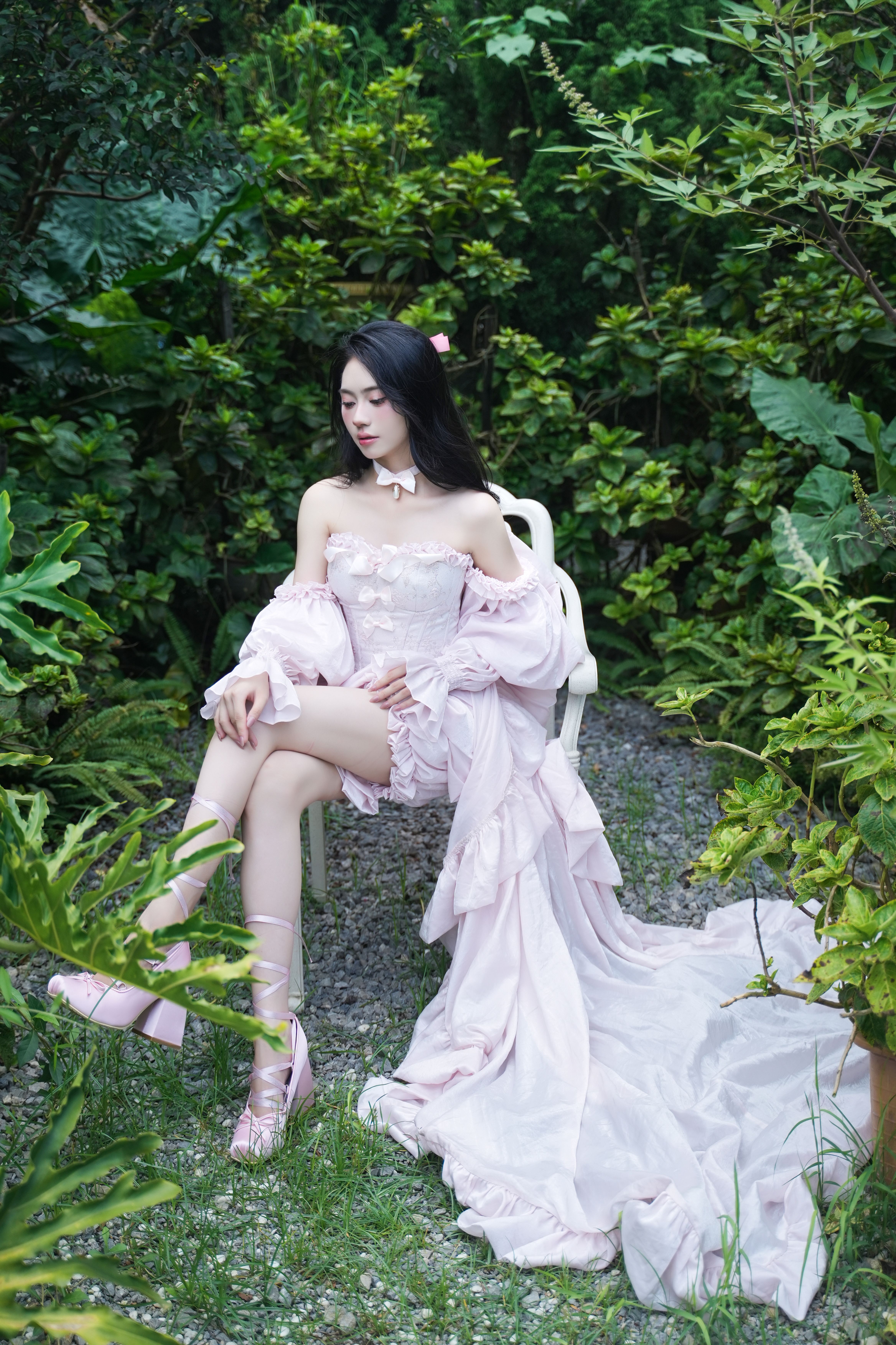 Elegant Woman in Pink Dress in Lush Garden · Free Stock Photo