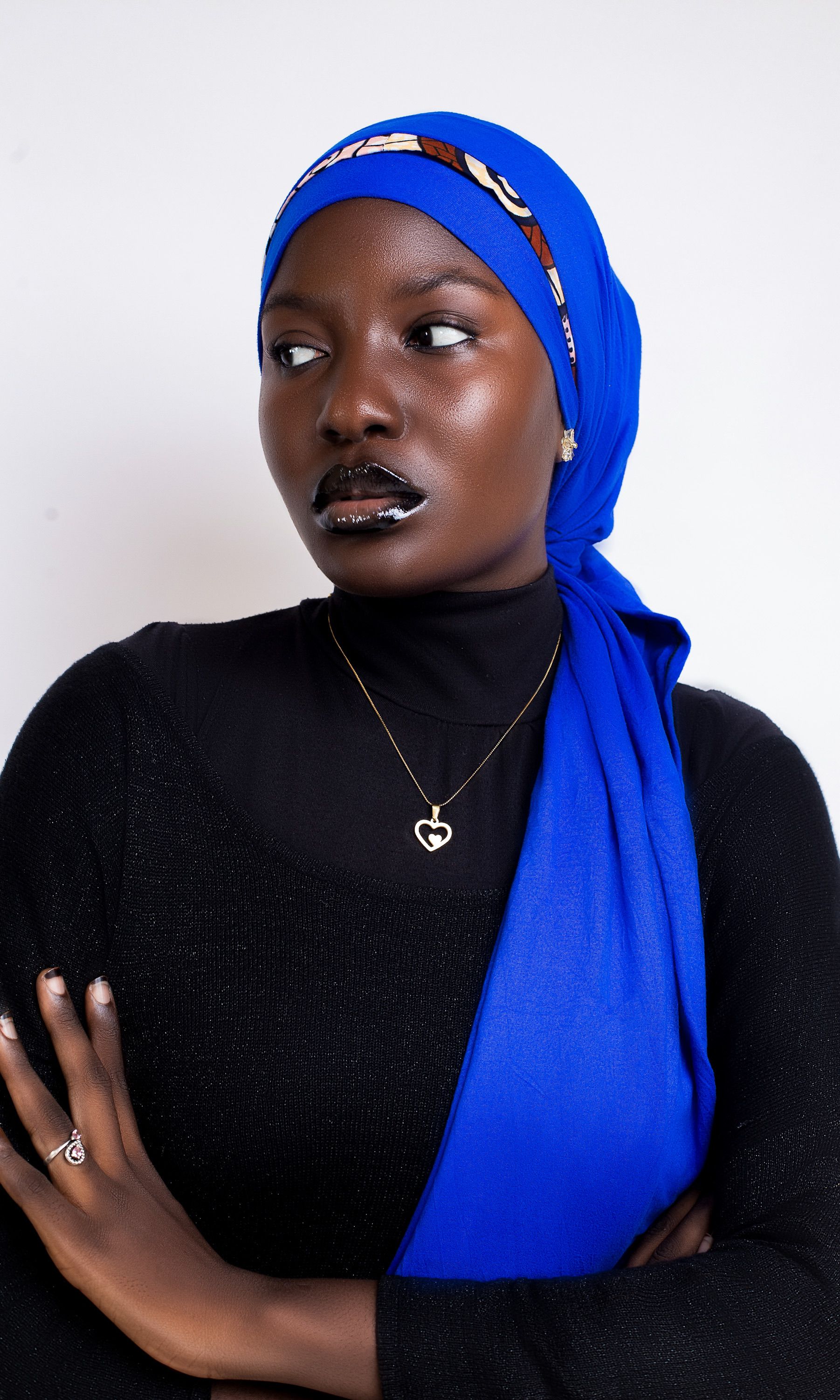 Elegant Portrait of a Woman in Blue Hijab · Free Stock Photo