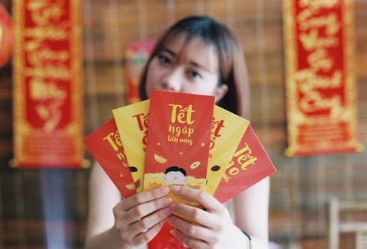 Woman holding Tet envelopes, symbolizing prosperity during Vietnamese Lunar New Year.