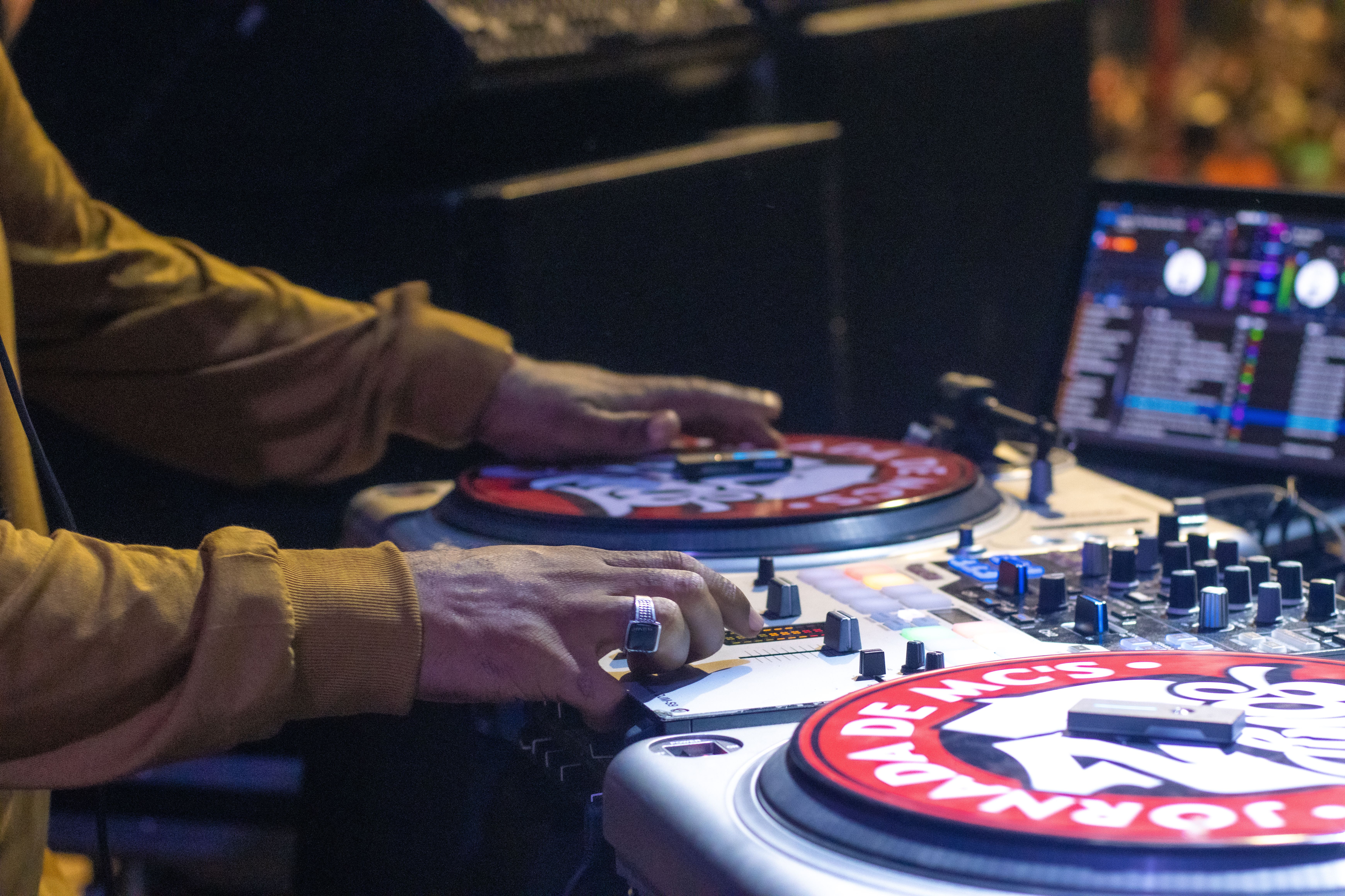 DJ Spinning Turntables at a Live Event · Free Stock Photo