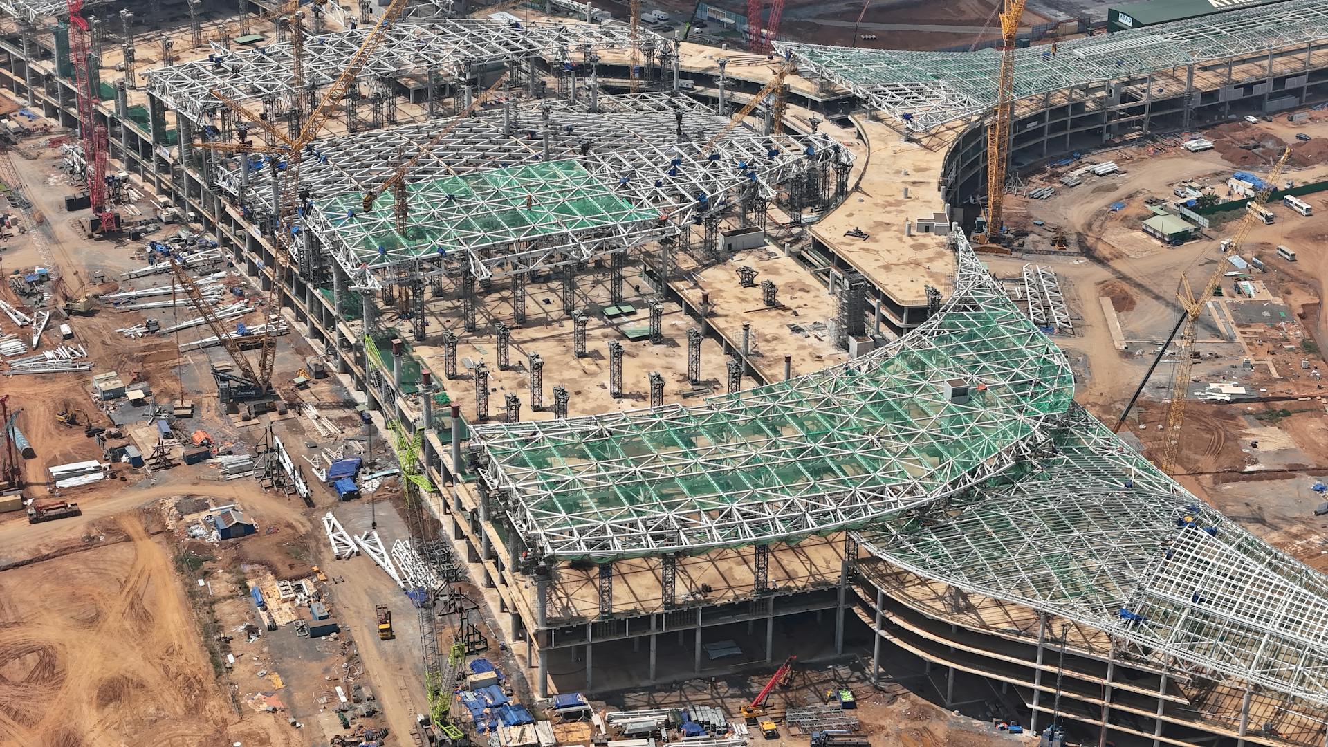 Aerial shot of a large-scale construction project with cranes in Đồng Nai, Việt Nam.