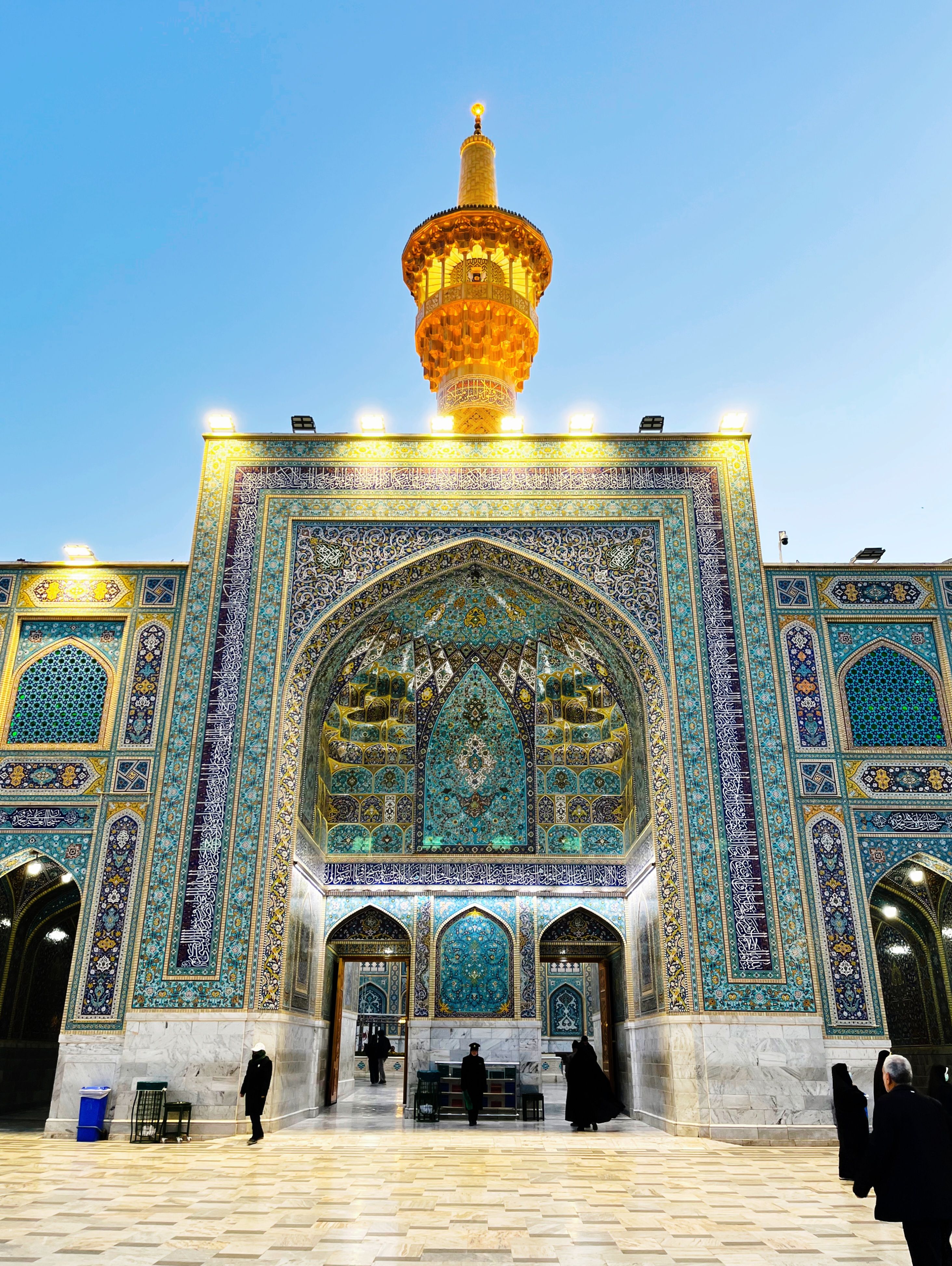 Beautiful architectural view of Imam Reza Shrine at sunset in Mashhad, Iran.