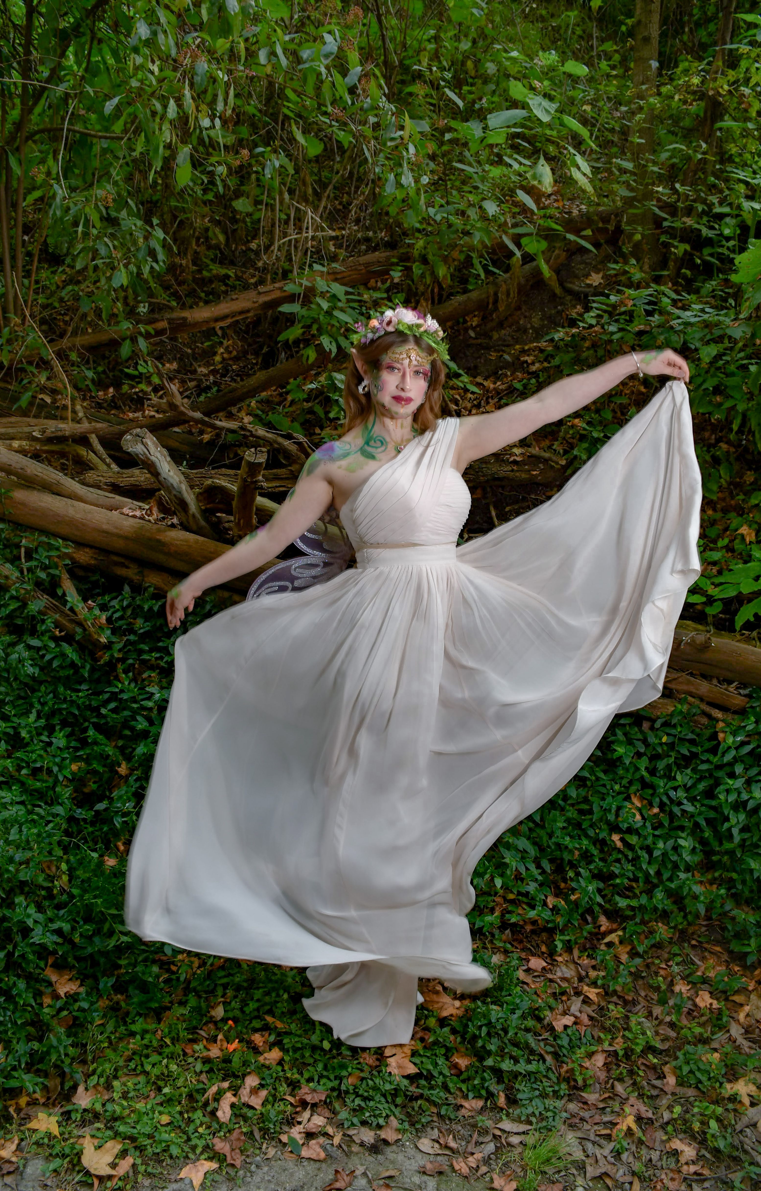 Elegant Woman in Flowing White Dress in Forest  Free Stock Photo