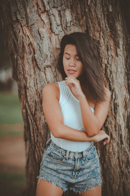Free Woman Leaning On A Tree Stock Photo