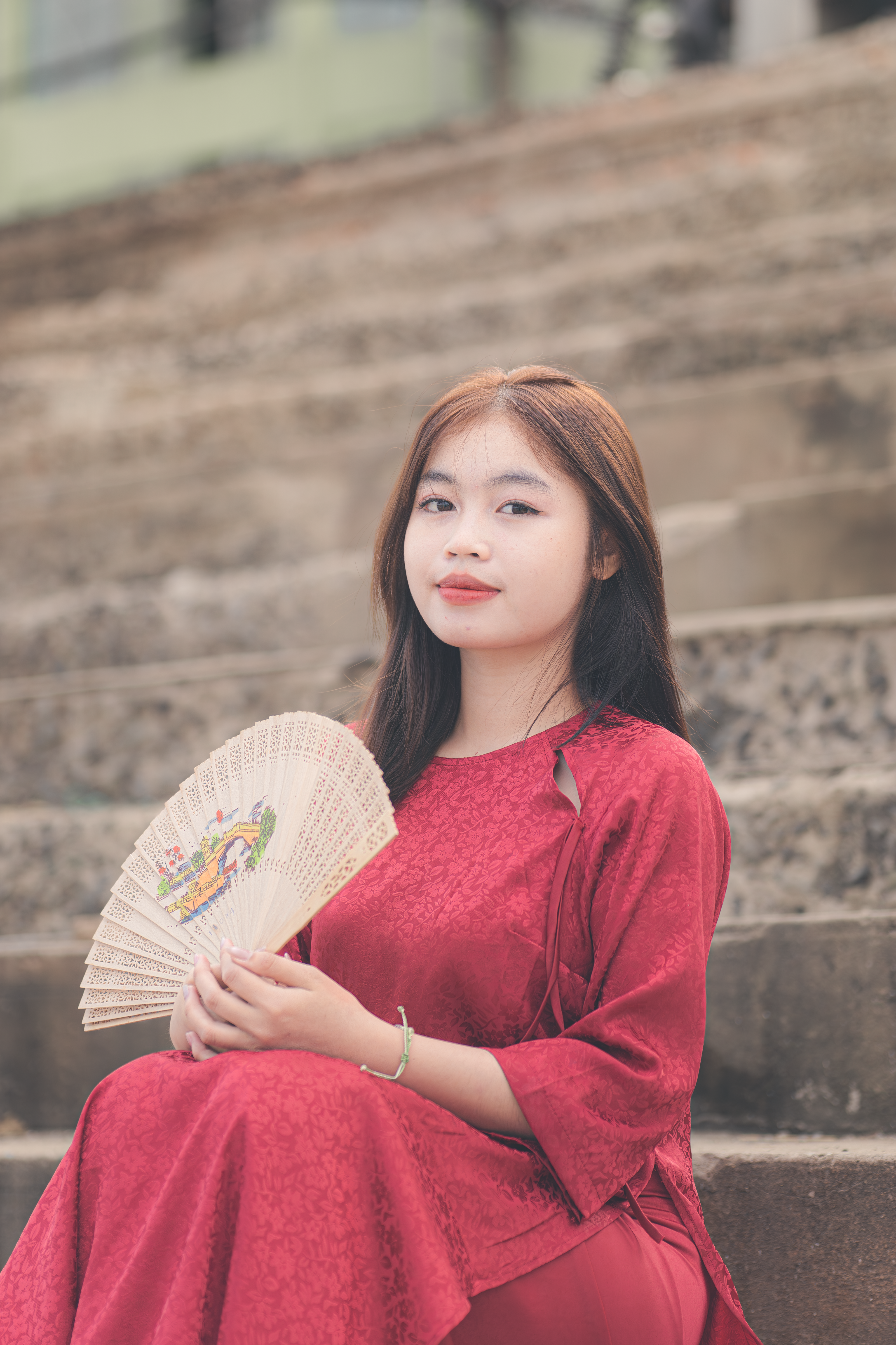 Young Woman in Red Dress Holding Traditional Fan · Free Stock Photo