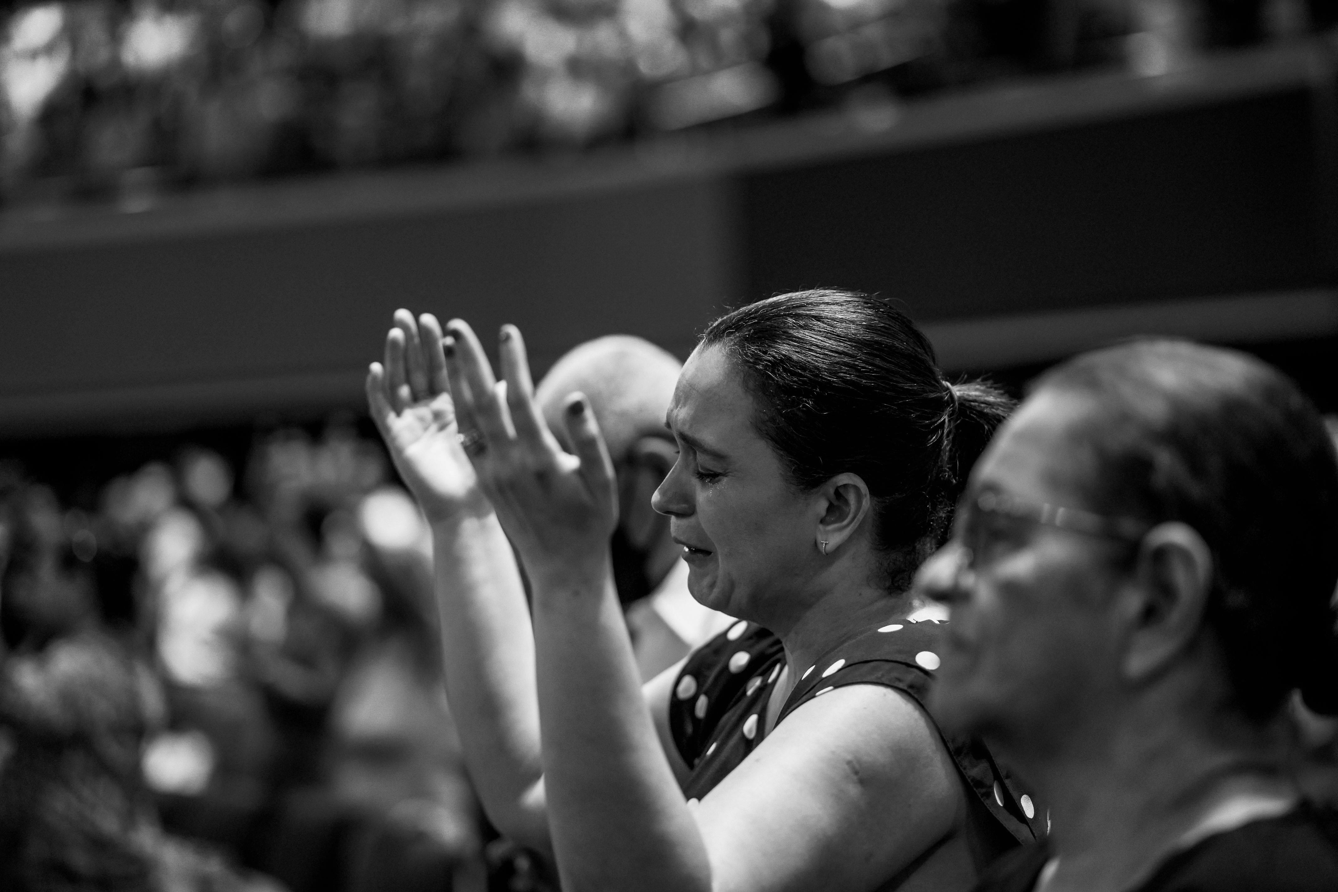 Black and white emotional worship photography suggesting deep reflection and tears
