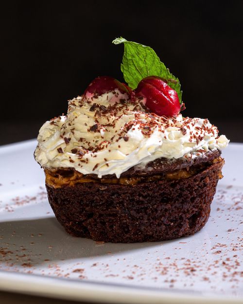 Chocolate cupcake with cream and cherries — Oksana D on Pexels