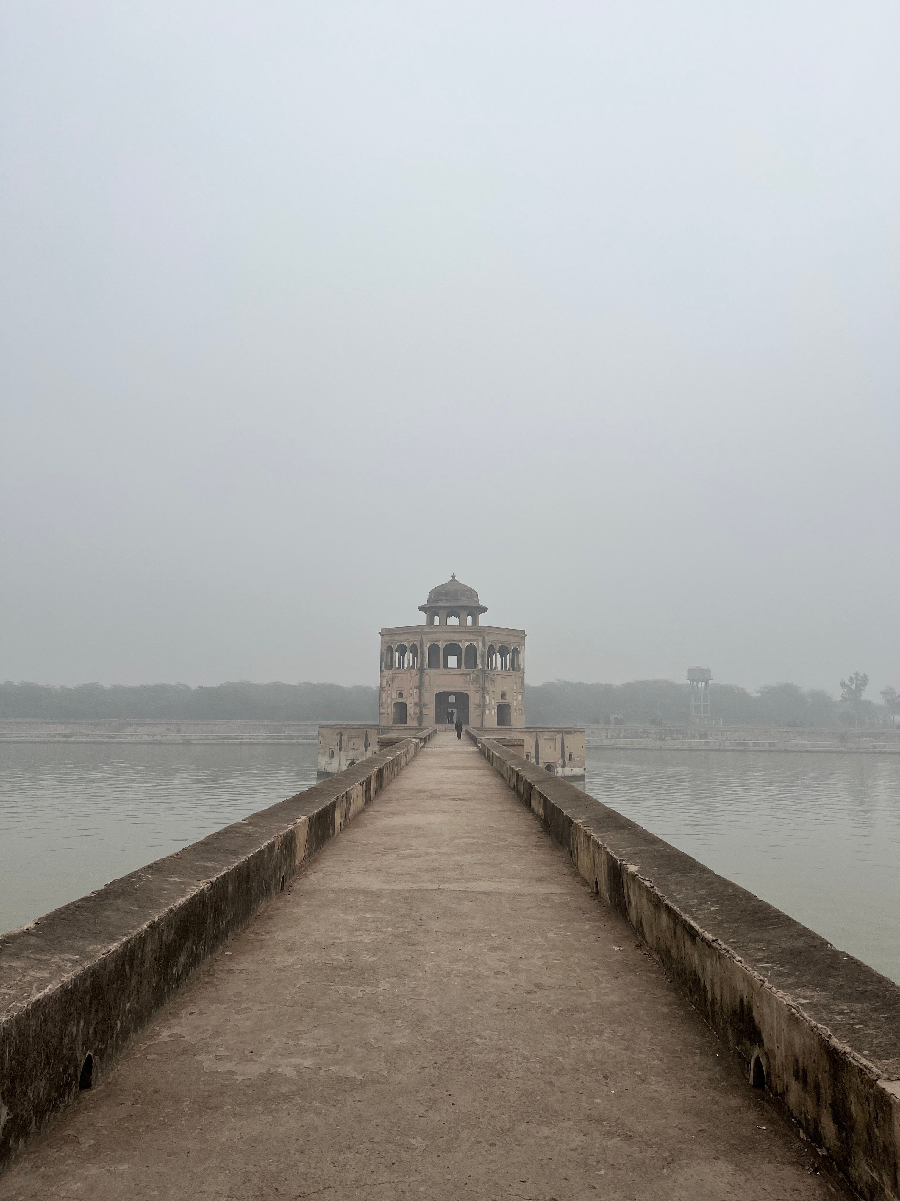 Serene view of Hiran Minar in a foggy winter morning in Lahore, Pakistan.