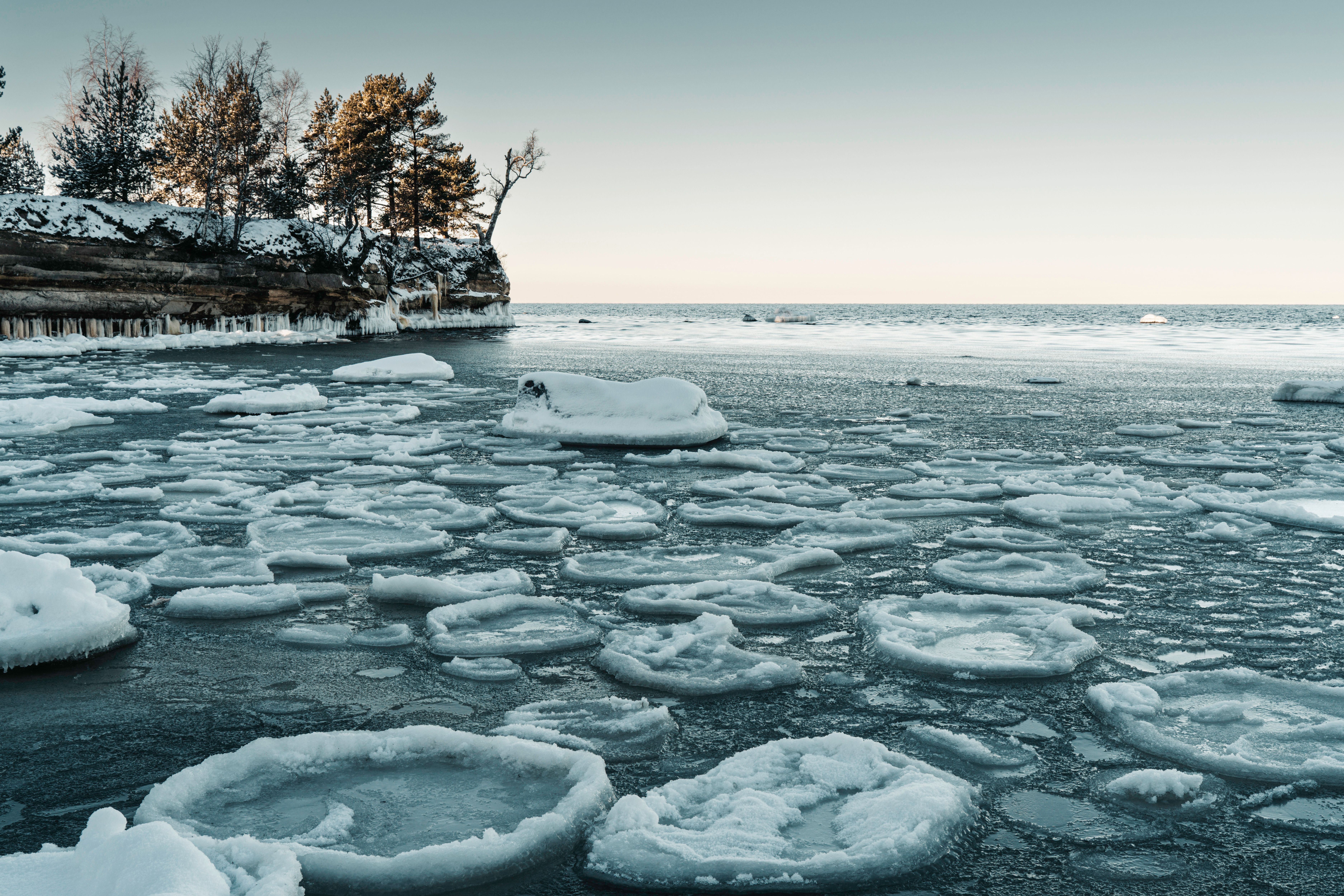 Frozen Lake Shoreline with Ice Formations · Free Stock Photo