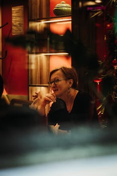 A woman enjoying a relaxing moment in a cozy cafe setting in London, UK.