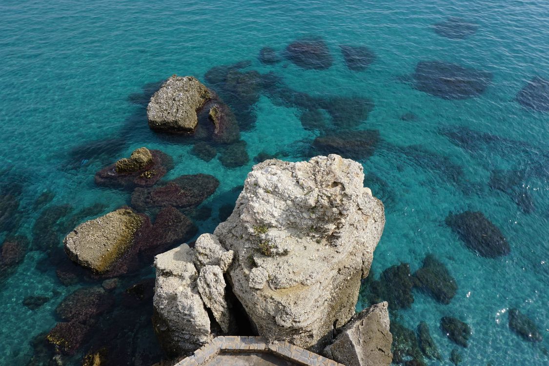 Clear Sea Rocks Scenic Coastal Rocks and Clear Blue Sea · Free Stock Photo