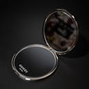 Elegant Gucci Compact Mirror on Black Background