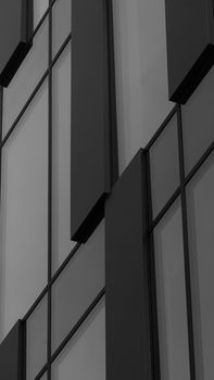 Black and white photo of modern building facade in Kraków, Poland.