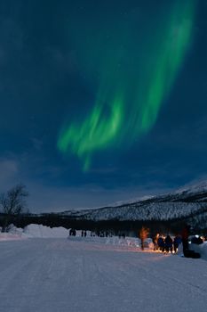 Breathtaking aurora borealis lights up the night sky in Kilpisjärvi, Lapland, Finland.