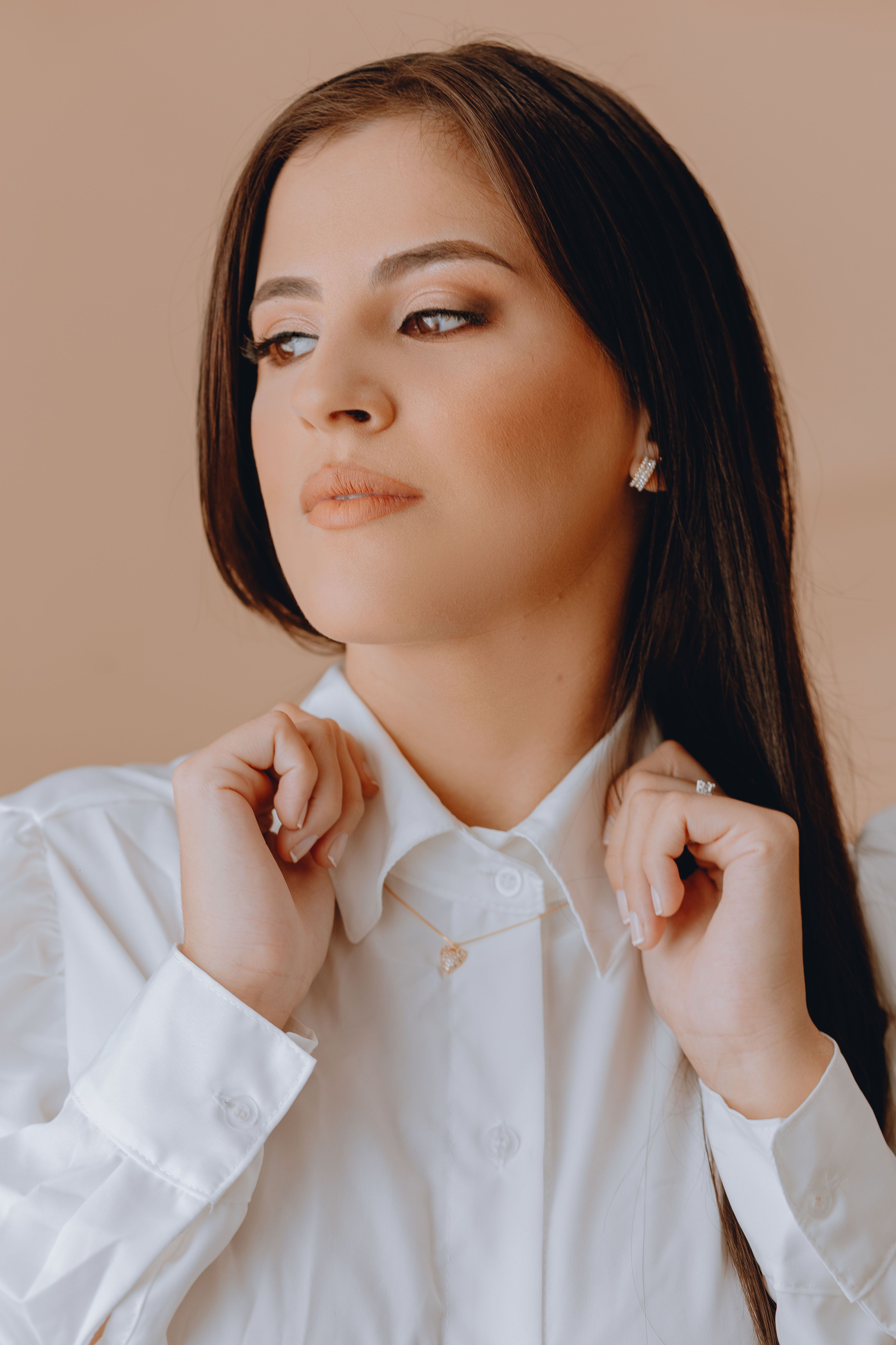 Elegant Woman in White Blouse Portrait · Free Stock Photo